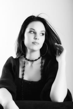 one brunette woman posing in studio 