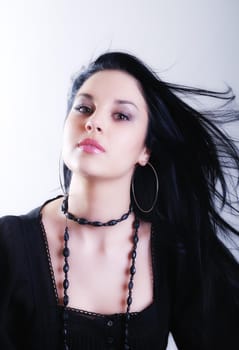 one brunette woman posing in studio 