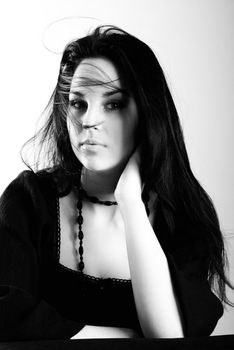 one brunette woman posing in studio 