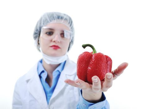 isolated on white young nurse doctor woman with red vegetable food papper representing bio food concept 