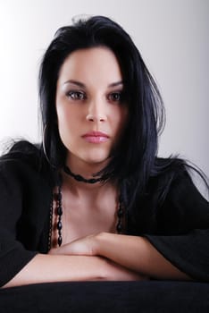 one brunette woman posing in studio 