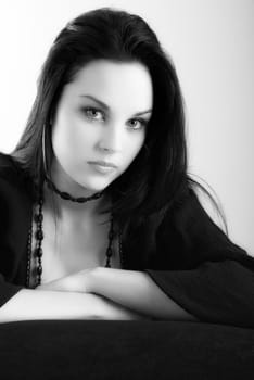 one brunette woman posing in studio 