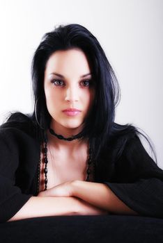 one brunette woman posing in studio 