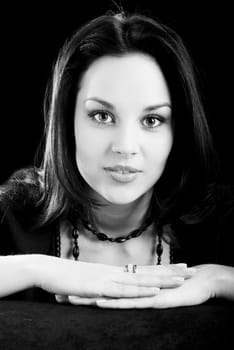 one young beautiful brunette  woman in black posing in studio