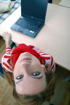 woman in red working on laptop at bright  office