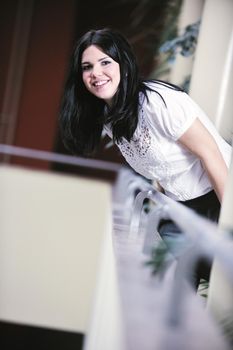 young happy business woman or student posing in fashionable clothes indoor in bright building 