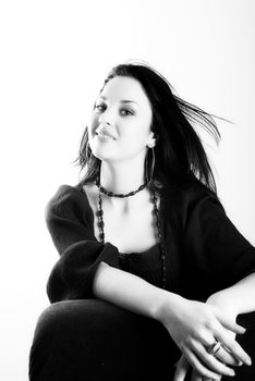 one brunette woman posing in studio 