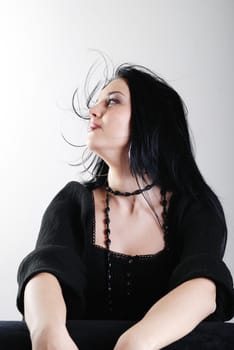 one brunette woman posing in studio 