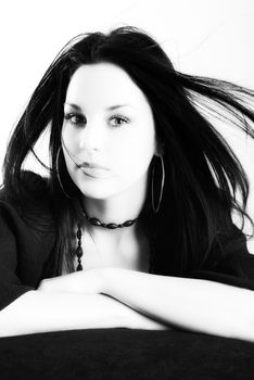 one brunette woman posing in studio 