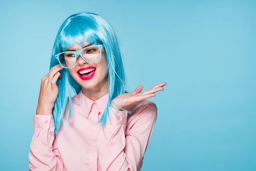 pretty woman in pink shirt purple wig glasses red lips. High quality photo