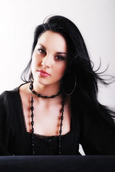 one brunette woman posing in studio 