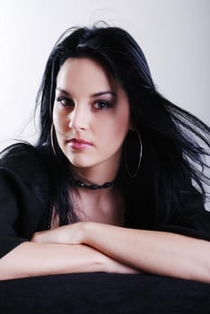 one brunette woman posing in studio 