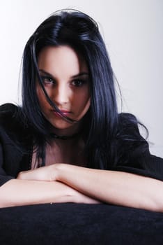 one brunette woman posing in studio 