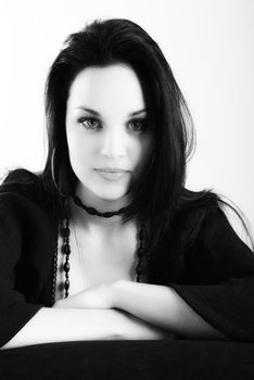 one brunette woman posing in studio 