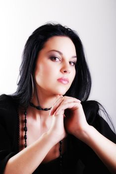 one brunette woman posing in studio 