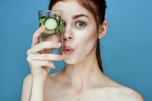 pretty woman with cucumber drink health vitamins. High quality photo