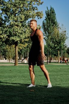 sports man in the park exercise fitness cardio. High quality photo