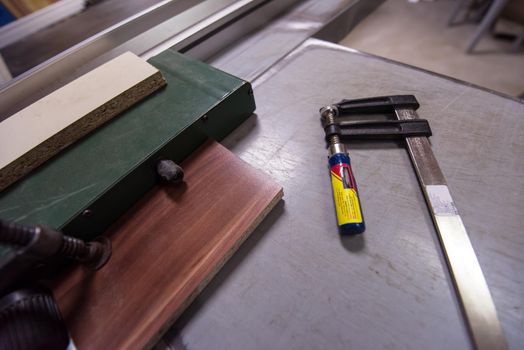 clamp and ruler tools on desk in factory for the production of wooden furniture