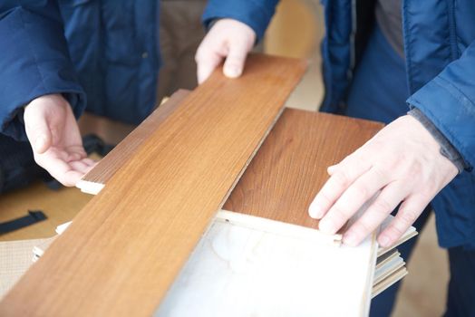 wood floor parquet shop selecting variants hands closeup