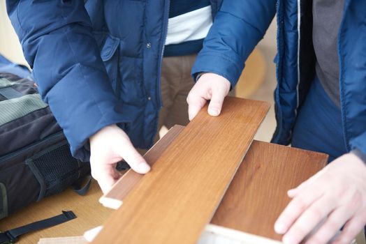 wood floor parquet shop selecting variants hands closeup