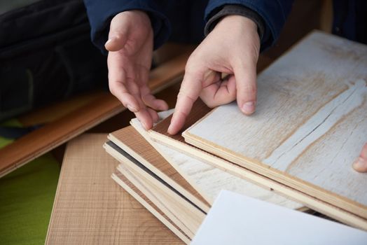 wood floor parquet shop selecting variants hands closeup