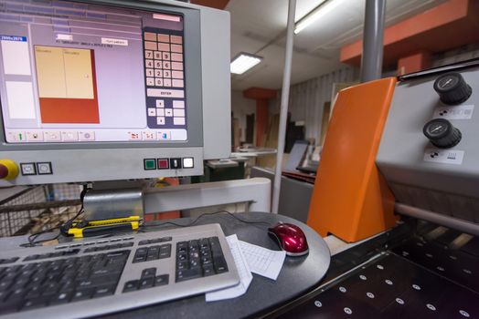 CNC wood cutting machine in big modern factory for the production of wooden furniture