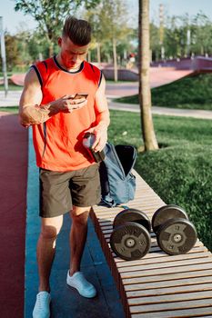 sporty man in the park workout exercise fitness motivation. High quality photo