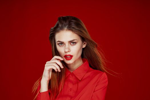 woman in red shirt posing fashion red lips fun. High quality photo