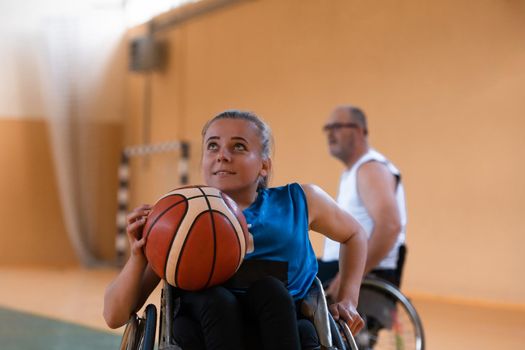 a young woman playing wheelchair basketball in a professional team. Gender equality, the concept of sports with disabilities. High quality photo