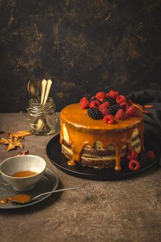 Delicious caramel cake with blackberries and raspberries.