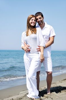 happy young couple have fun and romantic moments on beach at summer season and representing happynes and travel concept