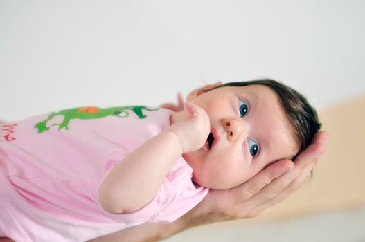 indoor portrait with happy young famil and  cute little babby 