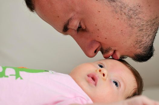 indoor portrait with happy young famil and  cute little babby 