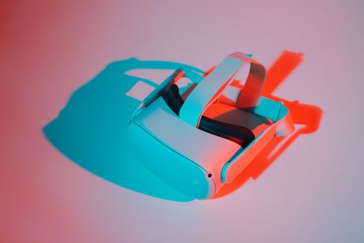 Virtual reality helmet on white background in neon light. VR, future, gadgets, technology concept.