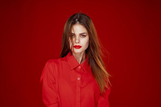 woman in red shirt posing fashion red lips fun. High quality photo