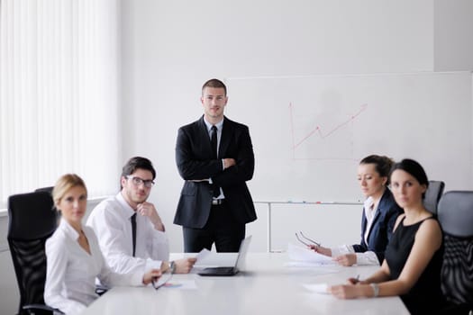 Group of happy young  business people in a meeting at office