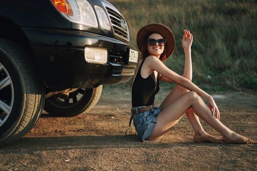 woman in sunglasses near car travel summer vacation landscape. High quality photo