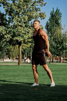 sports man in the park exercise fitness cardio. High quality photo