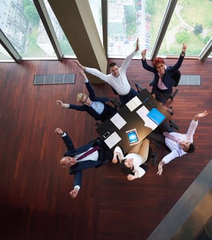 top view of  business people group on meeting throwing documents in air