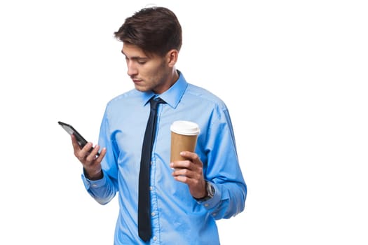 man in shirt with tie coffee cup posing office light background. High quality photo