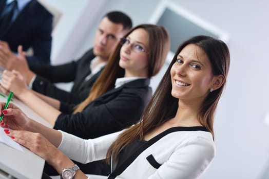 Group of happy young  business people in a meeting at office