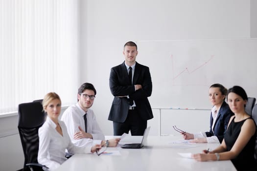 Group of happy young  business people in a meeting at office