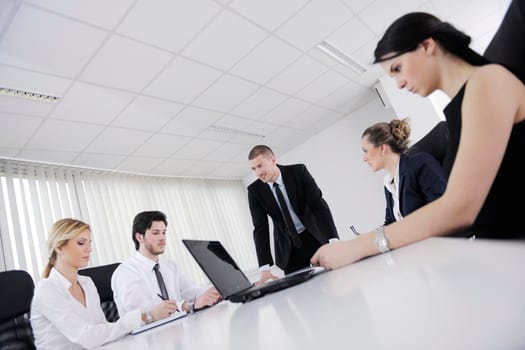 Group of happy young  business people in a meeting at office