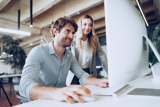 Young business people working together on project in modern office close up