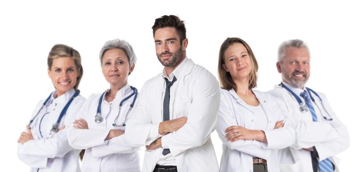 Team of successful medical doctors in labcoat uniform standing together with arms folded isolated on white background