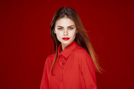 woman in red shirt posing fashion red lips fun. High quality photo