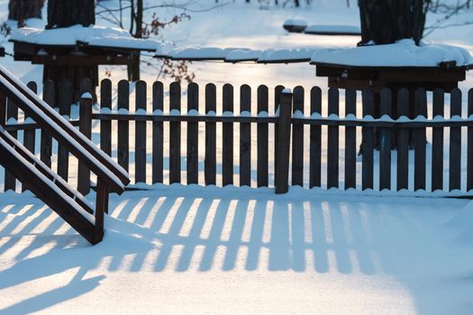 quiet winter evening on a snowy playground, winter vacation