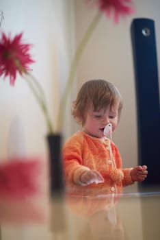 baby playing with tablet computer  at home