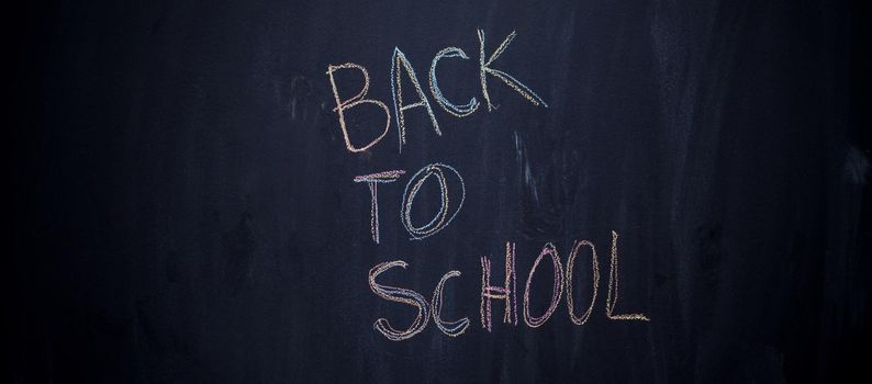 back to school drawing on black chalkboard