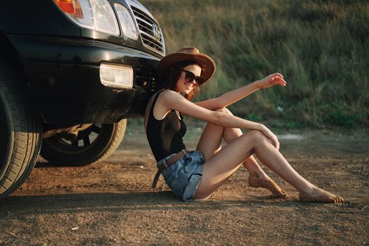 woman in sunglasses near car travel summer vacation landscape. High quality photo